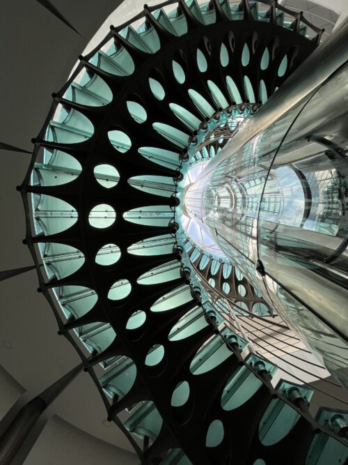 The winding spiral metal- and glass-based staircase gives the impression of a large-scale glass sculpture