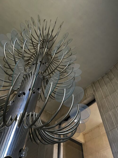 The once functional bulbs, spiralling around the steel column are now just an artistic decoration