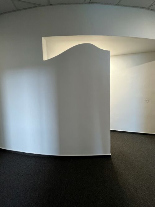 The three-dimensional design of the wall helps create the light effects