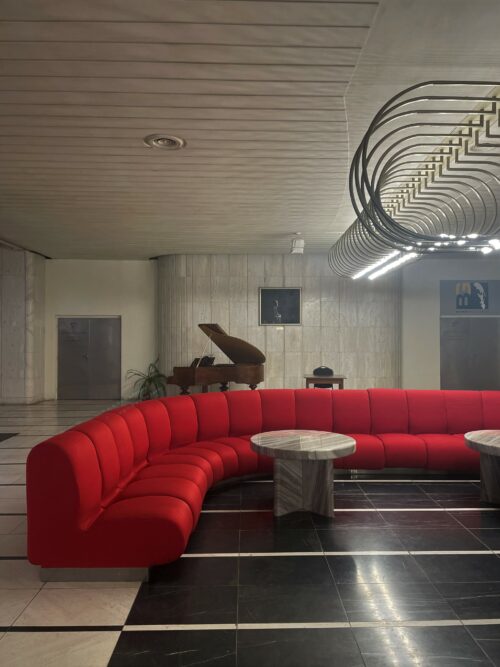 Visually dominant elements of the lobbies are the light objects and reupholstered seating furniture