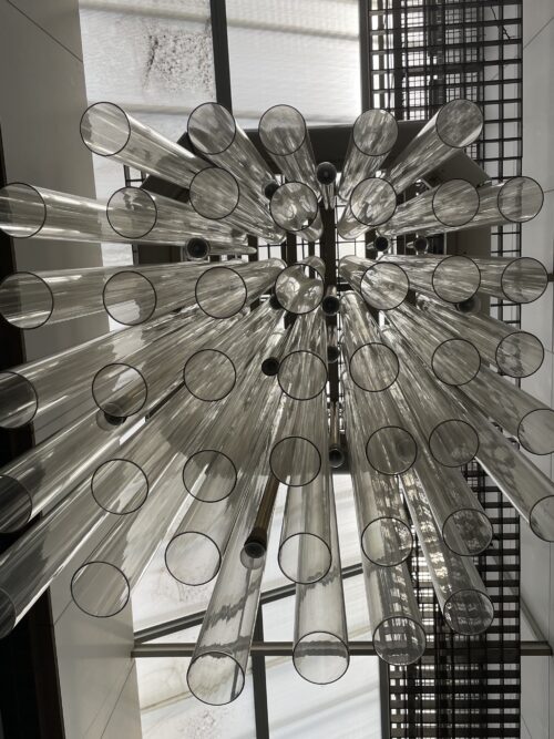 A detailed view of the sculptural light object above the staircase 
