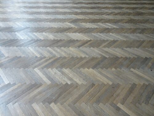The event hall – preserved wooden parquet floors laid in a herringbone pattern