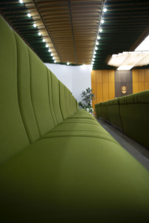 All-upholstered green seats are the dominating feature of the ceremonial hall   