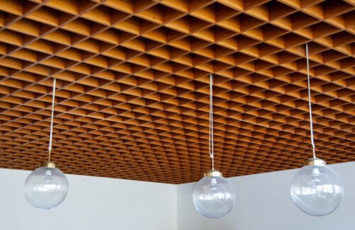 A close-up view of the still preserved wooden grid ceiling in the small theatre hall 