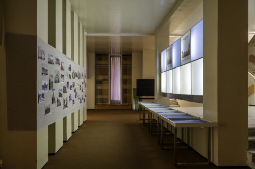 Several exhibition artefacts complement the conference room foreground