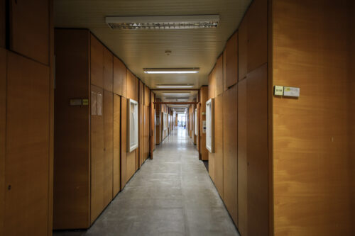 The corridors in the departments section are lined with built-in veneered cabinet systems 