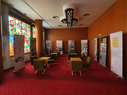 The lounge area of the upper foyer is also complemented by stained-glass windows created by Janko Alexy 