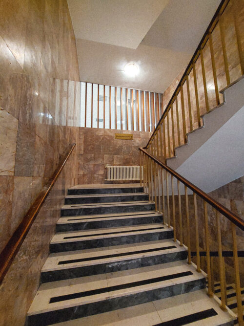 The staircase leading to hotel rooms in its preserved original design 